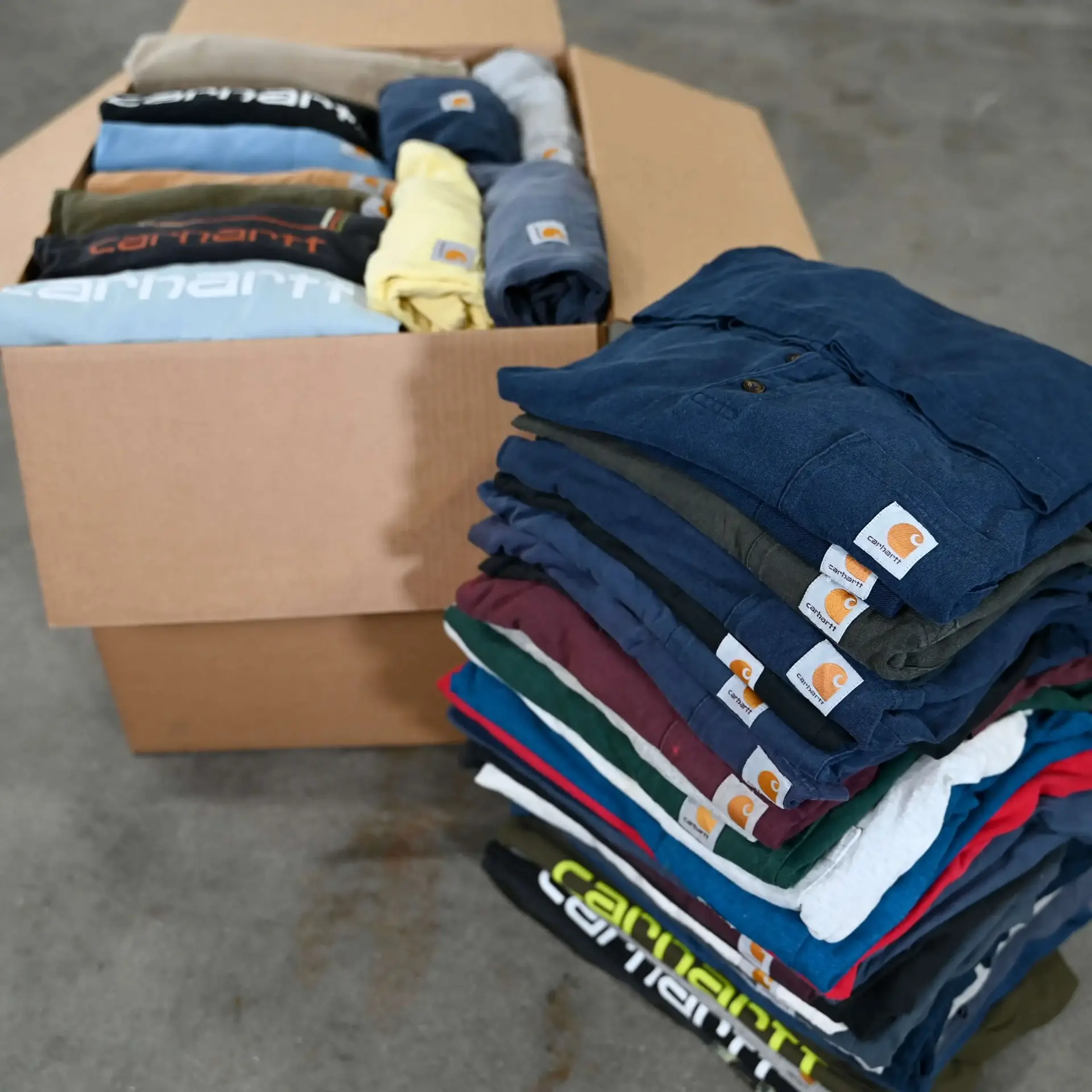 Hand-sorted vintage Carhartt pieces being prepared for WTC Club members